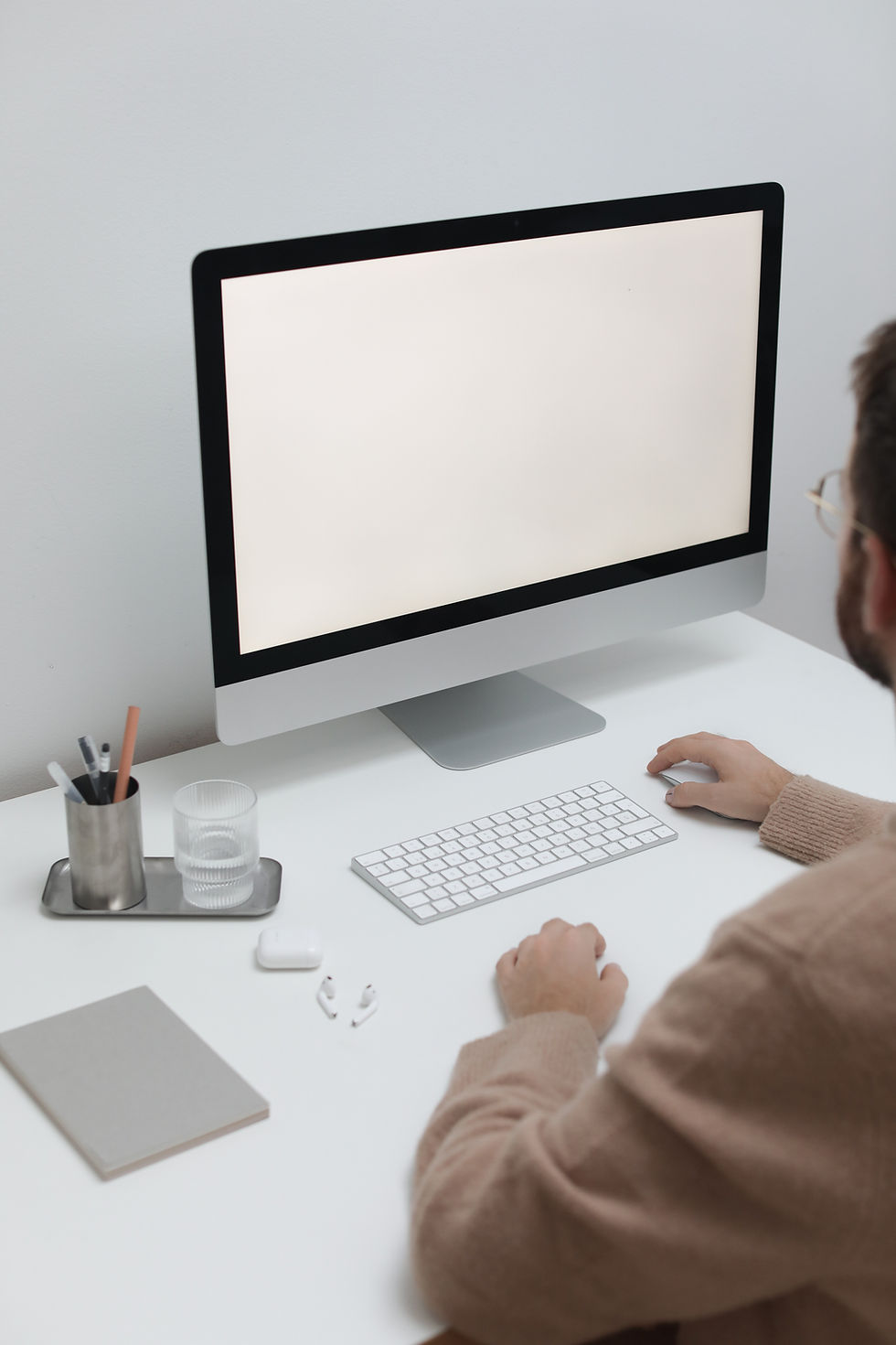 Man Working On Computer In Workplace