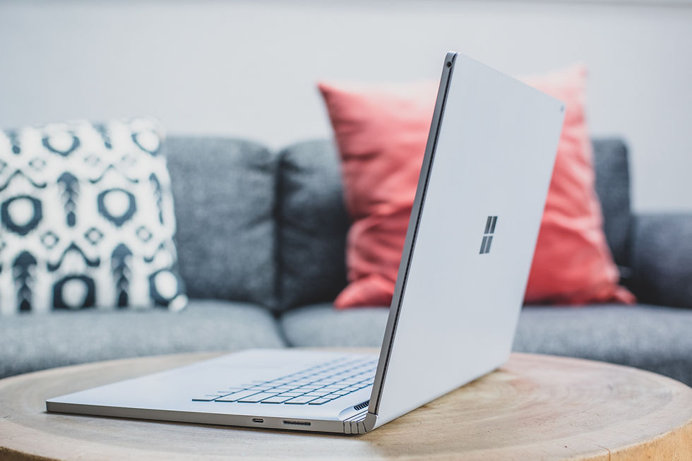 Microsoft Surface Laptop on a wooden coffee table