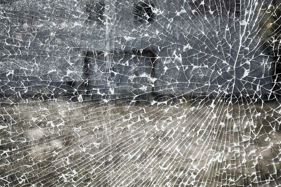 shattered glass against background